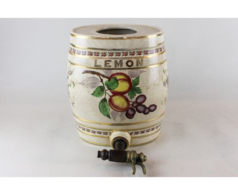 A ceramic lemon barrel,  oval shape with brass tap, decorated with fruit and gilt and floral bands, height 28cm