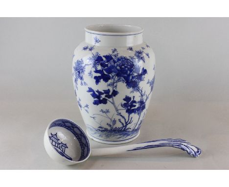 A Chinese blue and white porcelain vase, decorated with blossoming flowers and foliage, height 24cm, together with a blue and