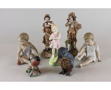 A Royal Worcester porcelain figure of a girl  holding a flowers 'He Loves Me', HN2046, a model of a bullfinch, a spelter king