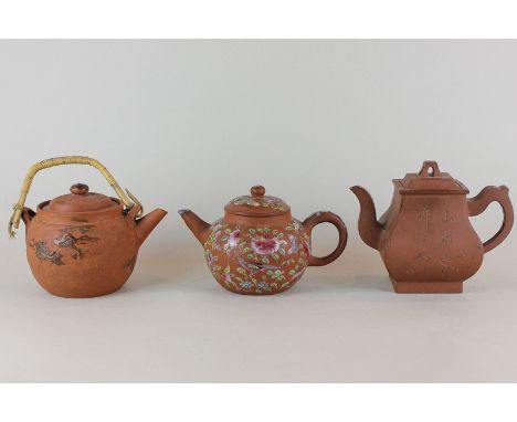 Two Chinese and one Japanese terracotta teapots decorated with character marks, naturalistic hand painting and dragons, two w