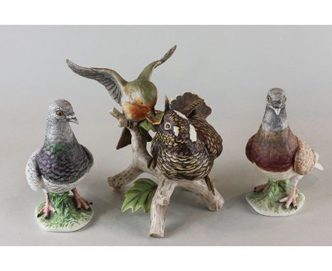 Goebel, a matt porcelain model of a robin feeding a young cuckoo, 23cm, and two models of carrier pigeons