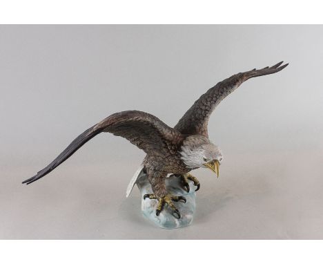 Goebel, a matt porcelain model of a white headed eagle with spread wings, 52cm