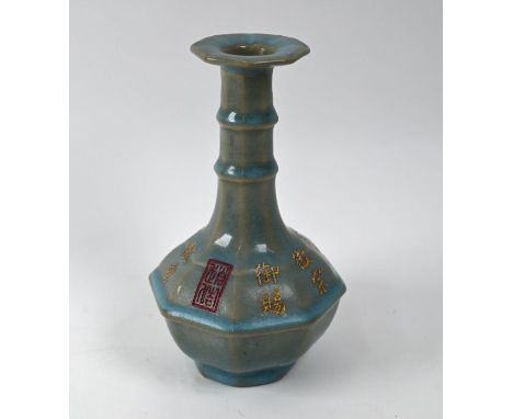 A 20th century Chinese Ru style octagonal bottle vase, light blue glaze with yellow kaishu inscriptions and red seal mark, 18