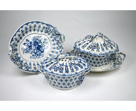 A pair of First Period Worcester blue and white chestnut baskets and covers on stands, with floral-painted decoration and pri