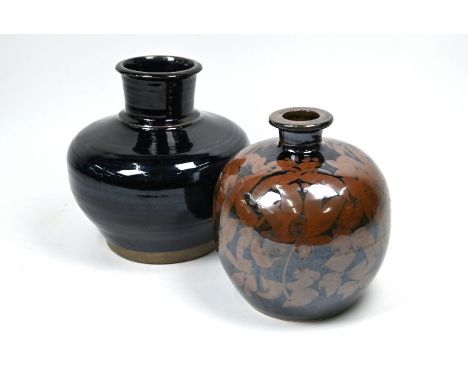 Two Chinese stoneware vases, the first with Wujin style mirror black glaze stopping short of the foot in the Song dynasty sty