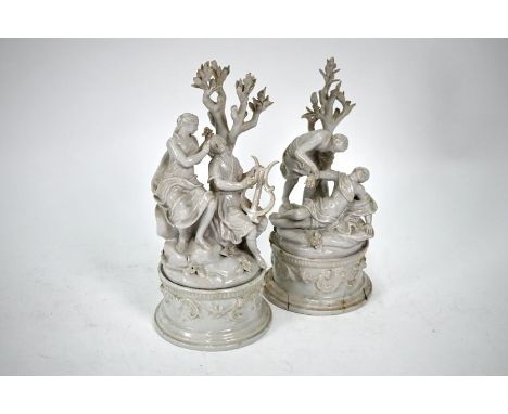 Two 19th century Nove (Venice) faience groups courting couple and man tending a fainting woman, on circular plinths 28 cm; fi