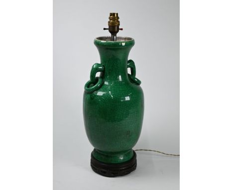 A 19th century Chinese porcelain baluster vase (lamped) with archaistic ring handles, crackled green glaze with contrasting w