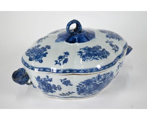 An 18th century Chinese blue and white cloud-form tureen and cover, painted with fruit sprays and floral designs in underglaz