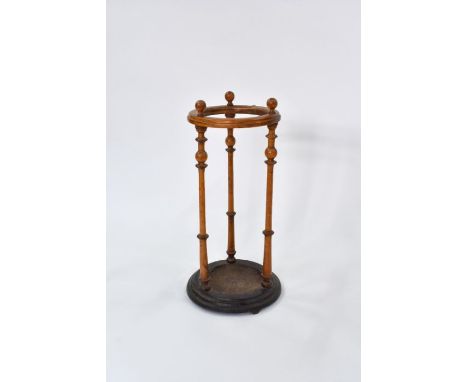 A late 19th century circular oak framed stick stand, with cast iron base Rd.191862, 28 cm dia. x 64 cm hOne leg wtih several 