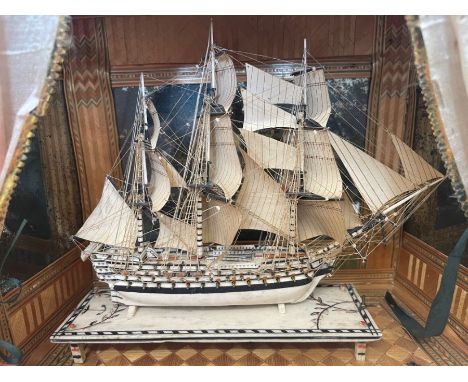 A fine miniature Napoleonic 'Prisoner of War' work bone model of a three-masted warship in full sail, with three decks of gun
