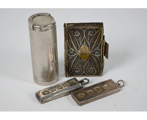 An engine-turned silver coin-holder, London 1985 to/w two ingots 1977 and a filigree gilt metal small needle case in the form