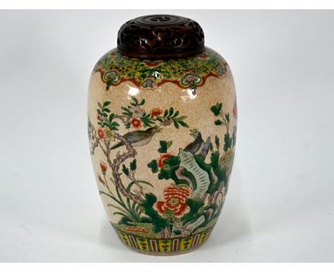 A 19th century Chinese famille verte ovoid jar painted in polychrome enamels with birds amongst flowering peony, prunus and r