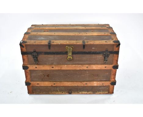 A vintage wood, leatherette and steel bound steamer trunk, with slightly bowed top, 92 cm x 56 cm x 64 cm h