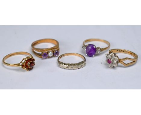 Five various 9ct yellow gold stone set rings including amethyst and pearl, garnet cluster, oval amethyst, diamond and ruby an