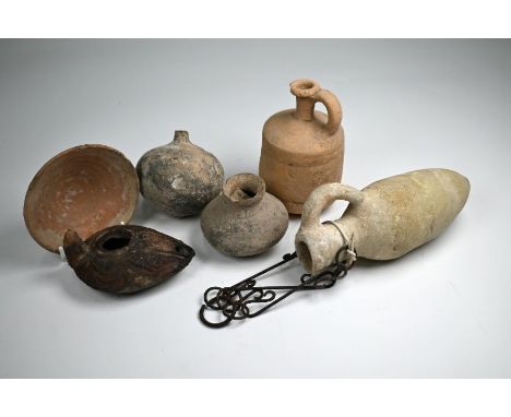 An antiquity terracotta oil-lamp with foliate decoration to/w five small eathenware vessels (6)
