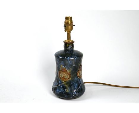 A Royal Doulton glazed stoneware bottle, embossed with stylised fruit, flowers and foliage, 20 cm, converted as a lamp