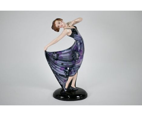 A large Goldscheider pottery figure modelled by Josef Lorenzl, female dancing in floral-stencilled lilac dress, holding her s