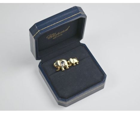A Chopard Happy Diamonds brooch featuring elephant with baby elephant, yellow metal stamped 750, with diamond set eyes and th