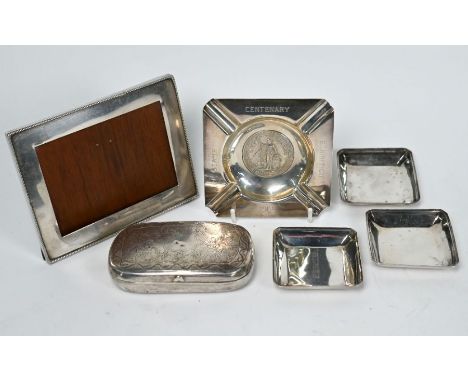 An antique Turkish white metal snuff box with floral engraved decoration Tughra stamps within, 10 x 6 x 2.5cm, to/w three sma