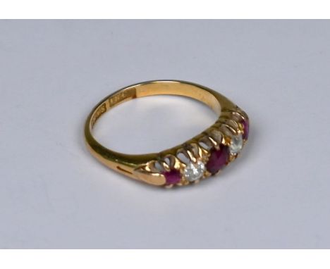 An antique 18ct yellow gold five stone ring set diamond and ruby, size L 1/2