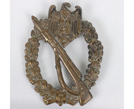 WW2 German Army / Waffen-SS Infantry assault badge in silver. Hollow tombac construction with soldered on needle. Presumably 