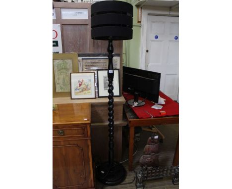 A gloss black finished barley twist column standard lamp, with modern shade 