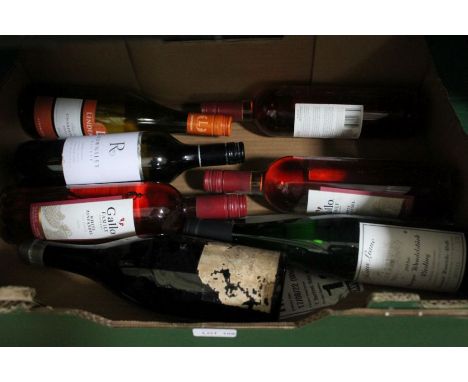 Seven bottles of alcoholic beverage, one of considerable vintage 