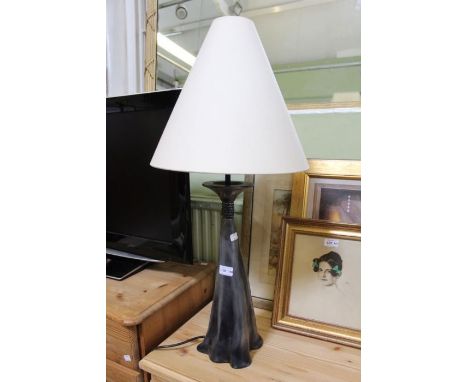 A single modernist table lamp