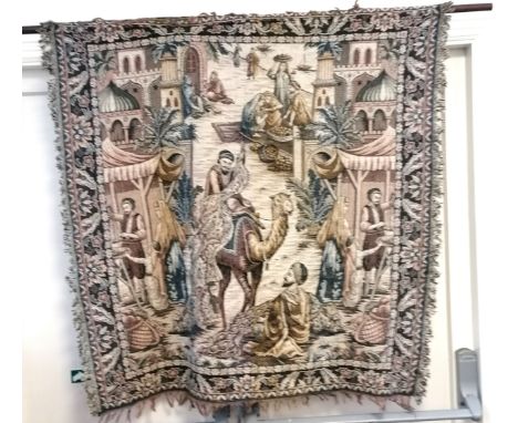Tapestry wall hanging of a Dutch interior scene, 174 cm width, 60 cm high, t/w  wall hanging of a Middle Eastern market scene