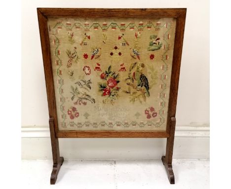 1866 tapestry sampler by Margaret Davies (aged 11) in a later firescreen stand - 72cm high x 55cm wide ~ slight staining 