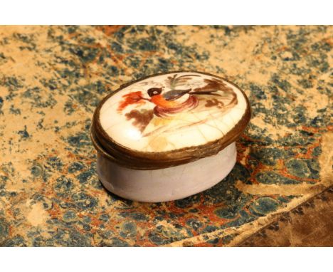 A George III South Staffordshire enamel oval patch box, hinged cover painted with a bird, pale blue base, 4.5cm wide, c.1800 