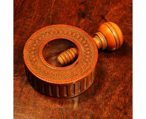 Nutcrackers - an early 19th century boxwood ring shaped screw-action pocket nut cracker, engine turned with roundels and inte