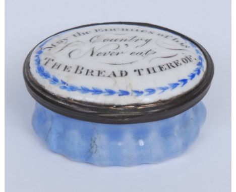 A George III South Staffordshire enamel oval patch box, hinged cover inscribed May the Enemies of His Country Never Eat The B