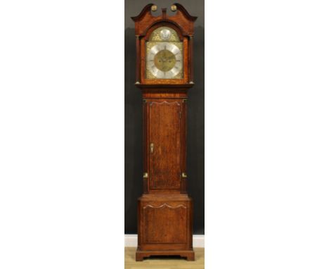 A George III oak and mahogany longcase clock, 34cm arched brass dial with silvered chapter ring inscribed with Roman and subs