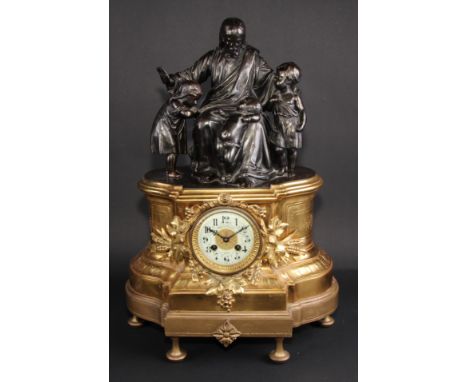 A French gilt brass and spelter figural mantel clock, 8.5cm circular dial inscribed TASSUS-CAUXIN À AUMALE, Arabic numerals, 