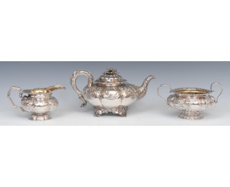 A matched George/William IV silver three piece melon shaped tea service, comprising teapot, milk jug and sugar basin, each ch