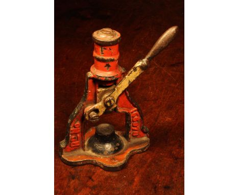 Nutcrackers - a Victorian cast iron mechanical table top nut cracker, the lever-operated mechanism with return spring, 17cm h