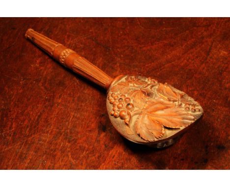 Nutcrackers - a Black Forest novelty screw-action nut cracker, carved with fruiting vine, lotus grip, 24.5cm long, c.1870 