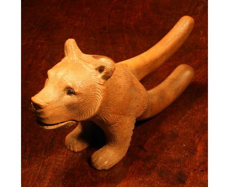 Nutcrackers - a  Black Forest novelty lever-action nut cracker, carved as a bear, head and forelegs, 20cm long, c.1900 