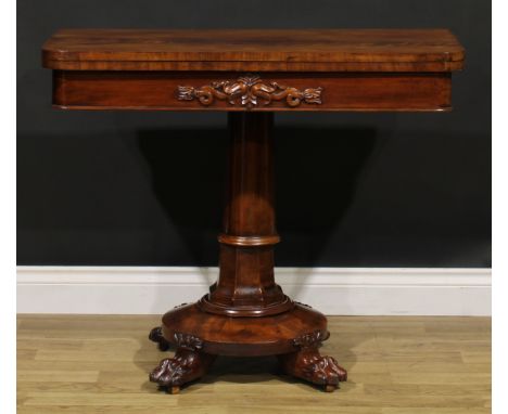 A George/William IV mahogany card table, hinged top above a deep frieze applied with lotus, circular base, paw feet, brass ca