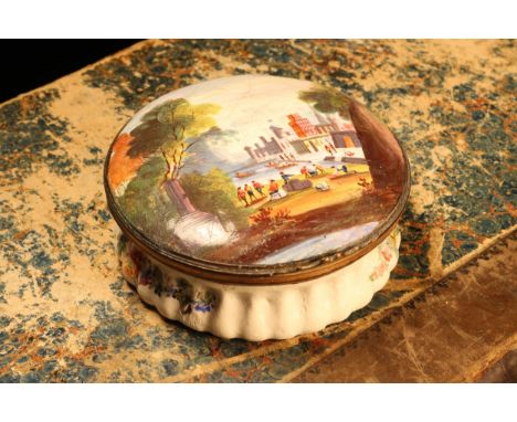 A George III South Staffordshire enamel circular table snuff box, hinged cover painted with an Italianate view, with figures 