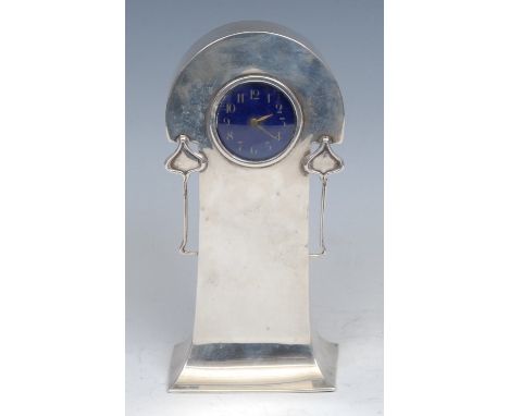 An Art Nouveau silver mantel timepiece, 4cm blue enamel clock dial inscribed with Arabic numerals, keyless movement, the arch