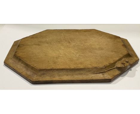 Robert Thompson, Mouseman of Kilburn - an oak canted rectangular bread board, adzed overall, carved mouse signature, 30.5cm w