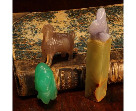 Alfred Lyndhurst Pocock (1882 - 1962), a chalcedony carving, of a ram, unsigned, 5cm long; a green stone carving, the head of