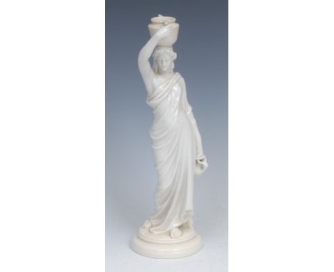 A Royal Worcester figures, of a female water carrier, she stands in flowing robes, an urn on her head, in the white, 24cm hig