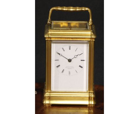 A late 19th century gilt brass repeating carriage clock, 6cm rectangular enamel dial inscribed Edward Bright, Pavillion Build