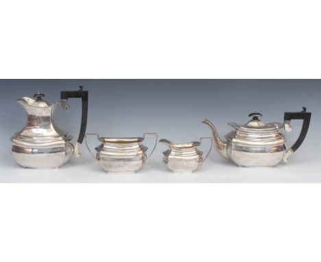 A George V silver four piece tea service, comprising teapot, hot water pot, milk jug and sugar basin, angular scroll handles,