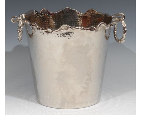 A Modernist silver plated champagne bucket, planished overall, stylised vine rim, conforming loose-ring handles, 21cm high 