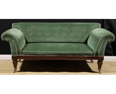 A William IV mahogany scroll arm sofa, stuffed-over upholstery, lotus carved turned legs, brass capped casters, 89cm high, 20