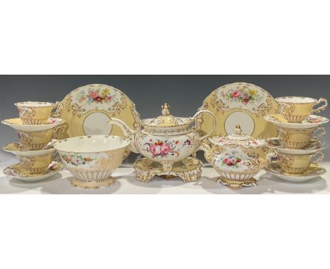 A Copeland and Garrett Rococo style tea service, painted with bright summer blooms on a corn yellow ground, the moulded borde